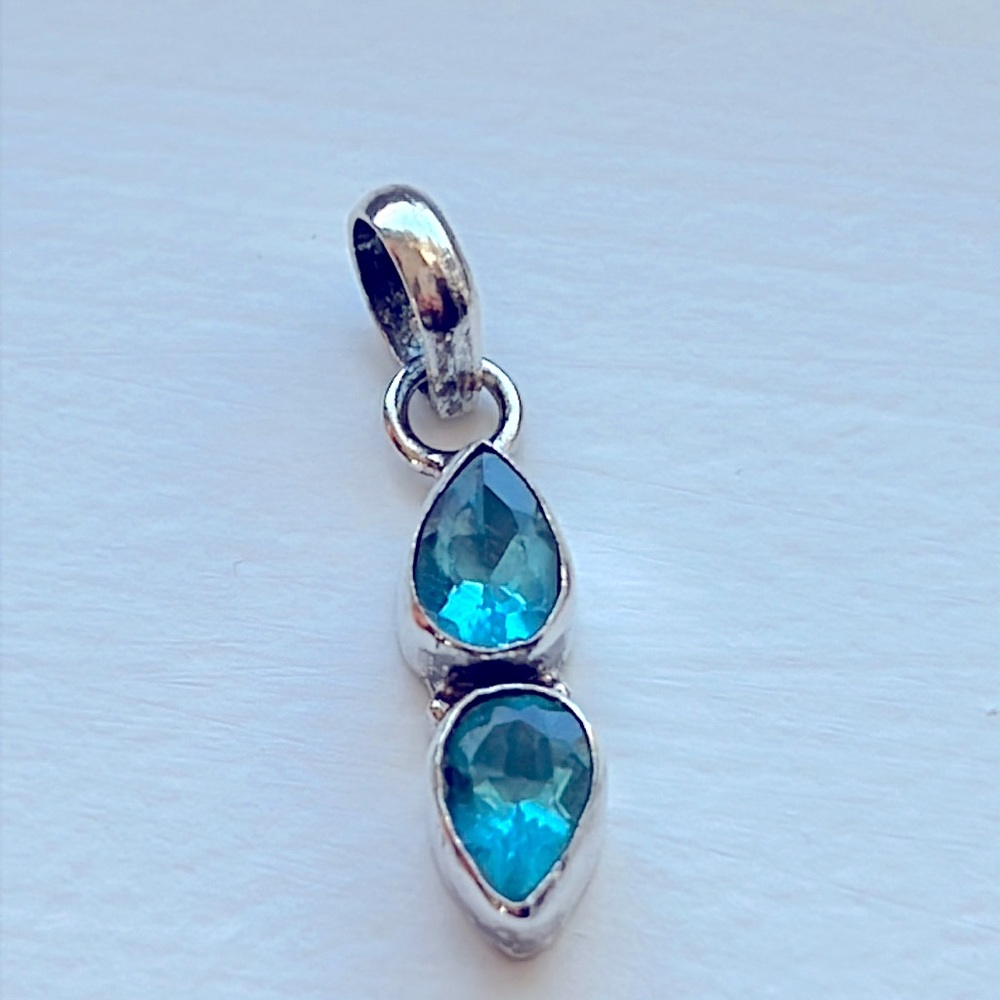 925S Silver Tear Drop Blue Topaz Stone